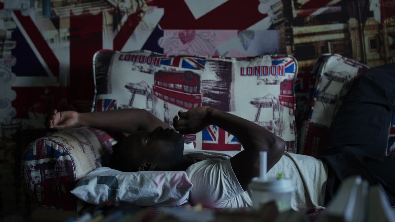 Man Lying on a Couch with Union Jack Theme