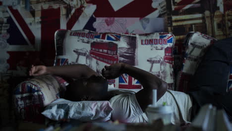 Man Lying on a Couch with Union Jack Theme