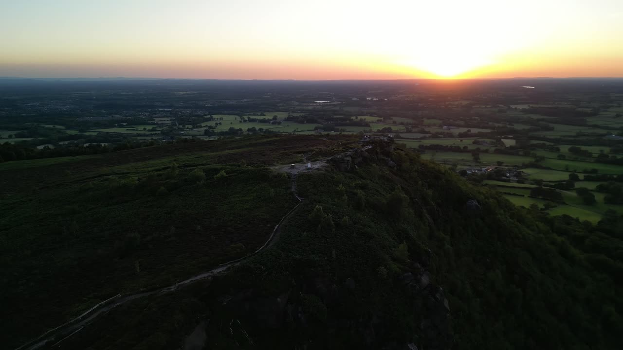 The stunning spiritual Cloud at Bosely on a full moon weekend at sunset , Staffordshire UK - drone fast clockwise rotate