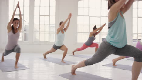 Yoga-class-multi-racial-group-of-women-exercising-fitness-healthy-lifestyle