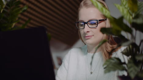 Attractive-Woman-Working-On-Laptop-At-Home-Office