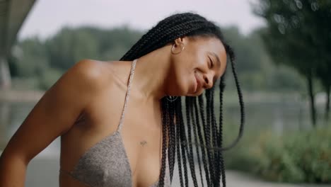 woman with braids in a park