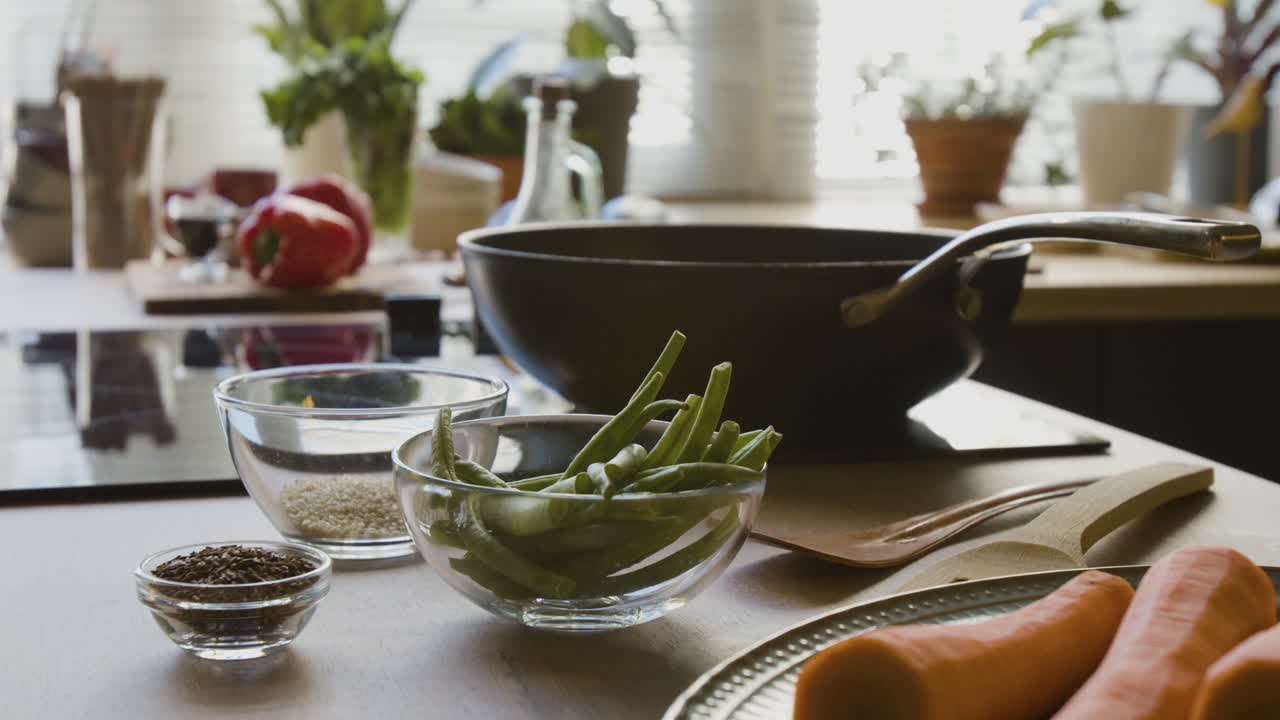 Cooking Green Beans and Carrots in a Modern Kitchen