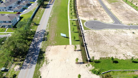 Flying-over-southern,-suburban-backroads-and-homes