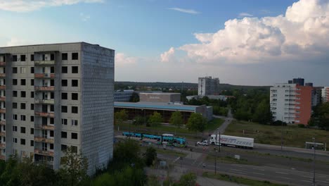 halle neustadt in germany, tramway station and the distinctive swimming pool building. unique aerial view flight fly reverse drone