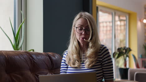 woman working on laptop at home