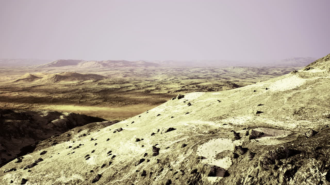 Expansive desert landscape under a pastel sky at dusk in a remote location