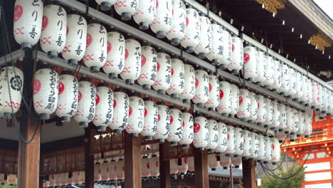 Asian-lanterns-hung-up-outside-early-in-the-morning-in-front-of-a-shrine-in-Kyoto,-Japan-soft-lighting