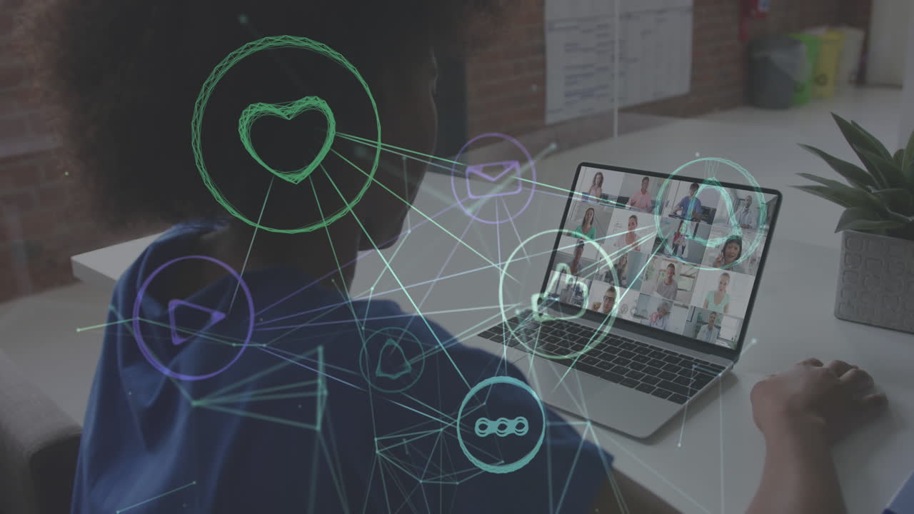 아프리카계 미국인 여성이 노트북에서 비디오 컨퍼런스를 하는 것에 대해 떠다니는 디지털 아이콘 네트워크