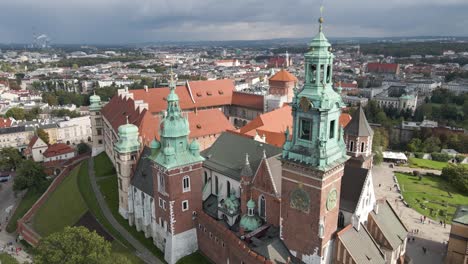 wide retreating shot of historic buildings in krakow poland on an overcast day