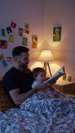 father reading bedtime story to children