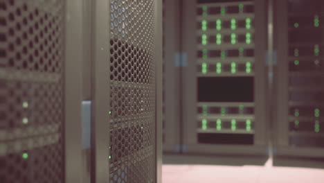 Shot-of-Corridor-in-Working-Data-Center-Full-of-Rack-Servers-and-Supercomputers