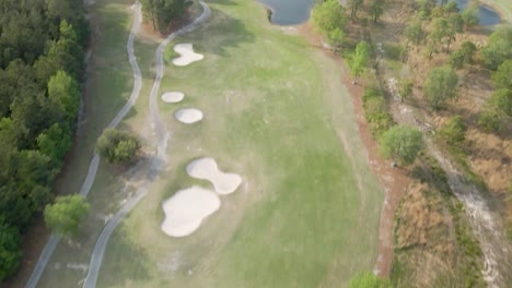aerial flight over magnolia greens golf course tilt reveal
