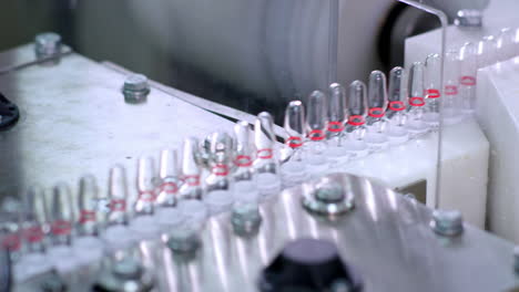 medical vials on production line at pharmaceutical plant. medical ampoules