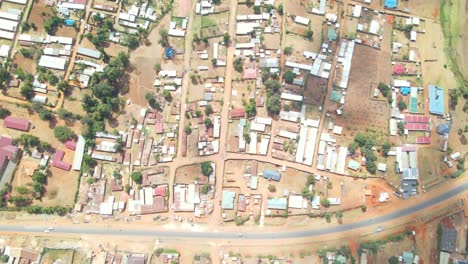 urban setting with unassuming buildings and poor roads in kenya, africa