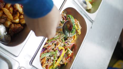 restaurant buffet with chicken salad and other dishes