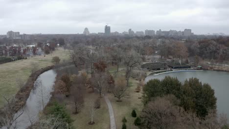 city park on dreary winter day, buildings in background