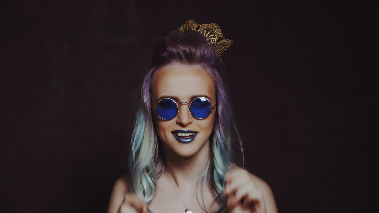 Beautiful girl with colored hair. Colored hairs. Portrait of smiling woman with color hairs. Gradient