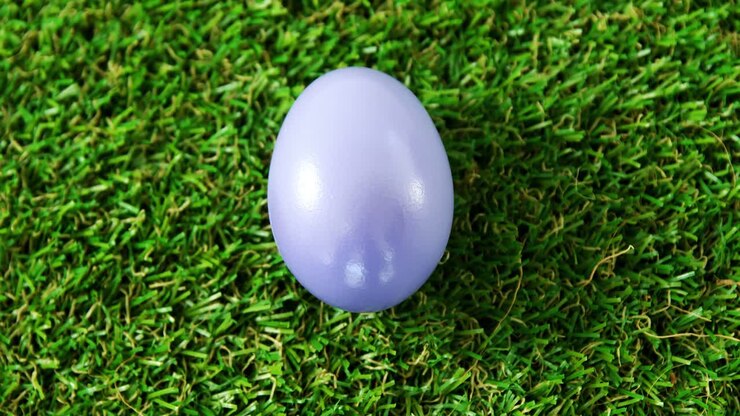 Purple Easter egg on artificial turf