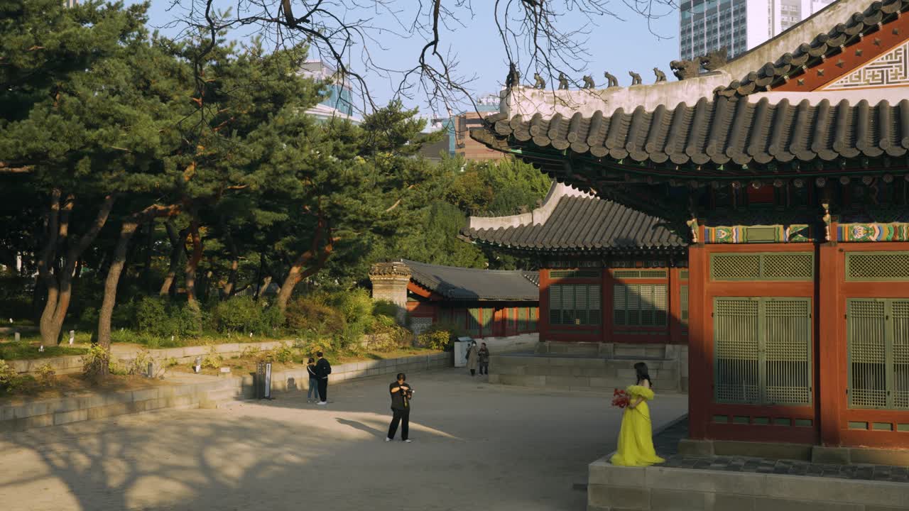 Visitors explore a traditional Korean palace garden