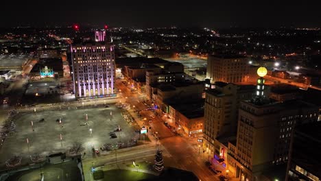 flint, michigan at night skyline with a wide shot of drone video circling