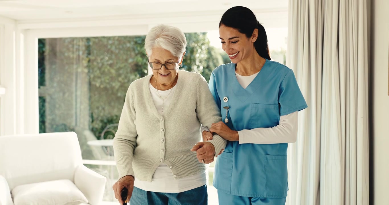 Caregiver Assisting Senior Woman Walking with Cane at Home