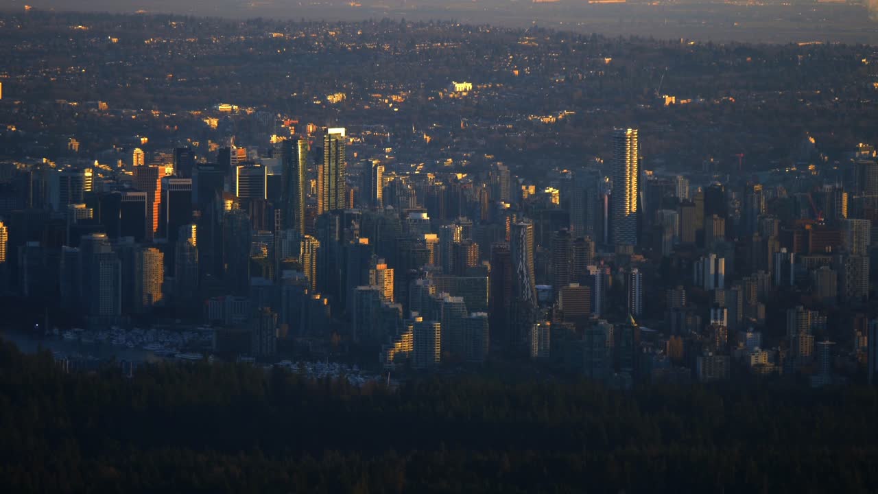 Downtown Vancouver, British Columbia, Canada - The City Skyline Glows in the Golden Light of Sunset - Aerial Drone Shot