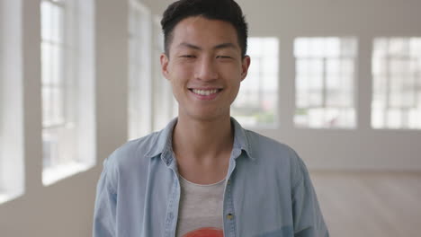 close up portrait of young asian man smiling enjoying independent lifestyle choice in new apartment