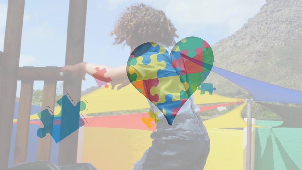 Animation of puzzle pieces with heart icon over african american schoolboy