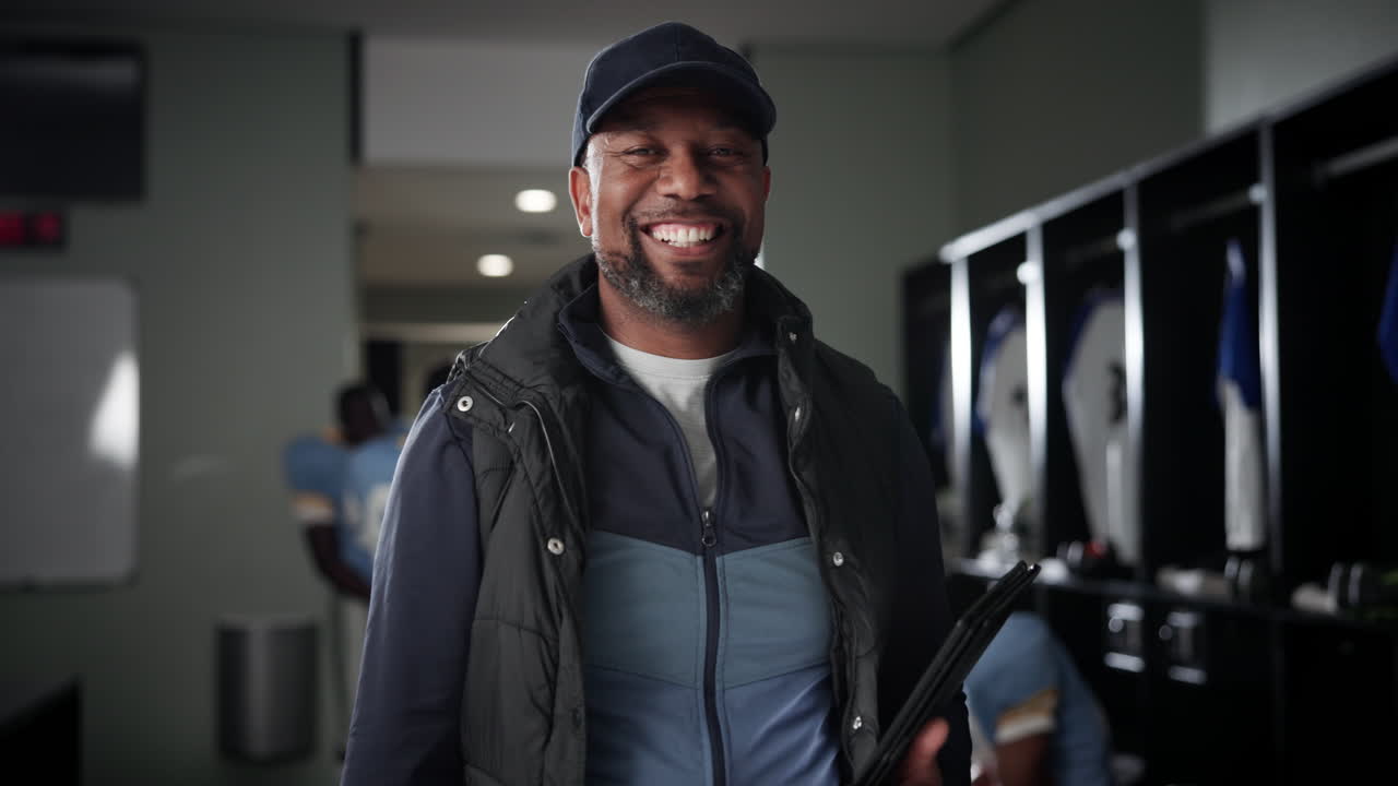 Football coach in locker room