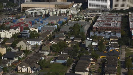 pan up drone shot from homes in houston forth ward that reveals downtown houston