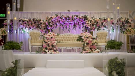 a view showcasing a beautiful stage arrangement at a classic wedding ceremony