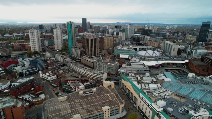 Smooth right to left tracking aerial of the Centre of Birmingham UK