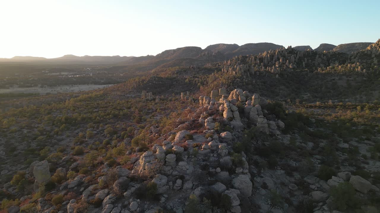 Golden hour view over rocky valley landscape in Creel, Valle de los Monjes, Mexico