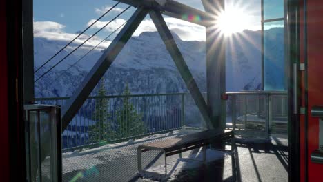 ski station with different modes of transportation going up and down the mountains such as ski-lifts, chair lifts, and cable cars, located at engelberg, in brunni, switzerland