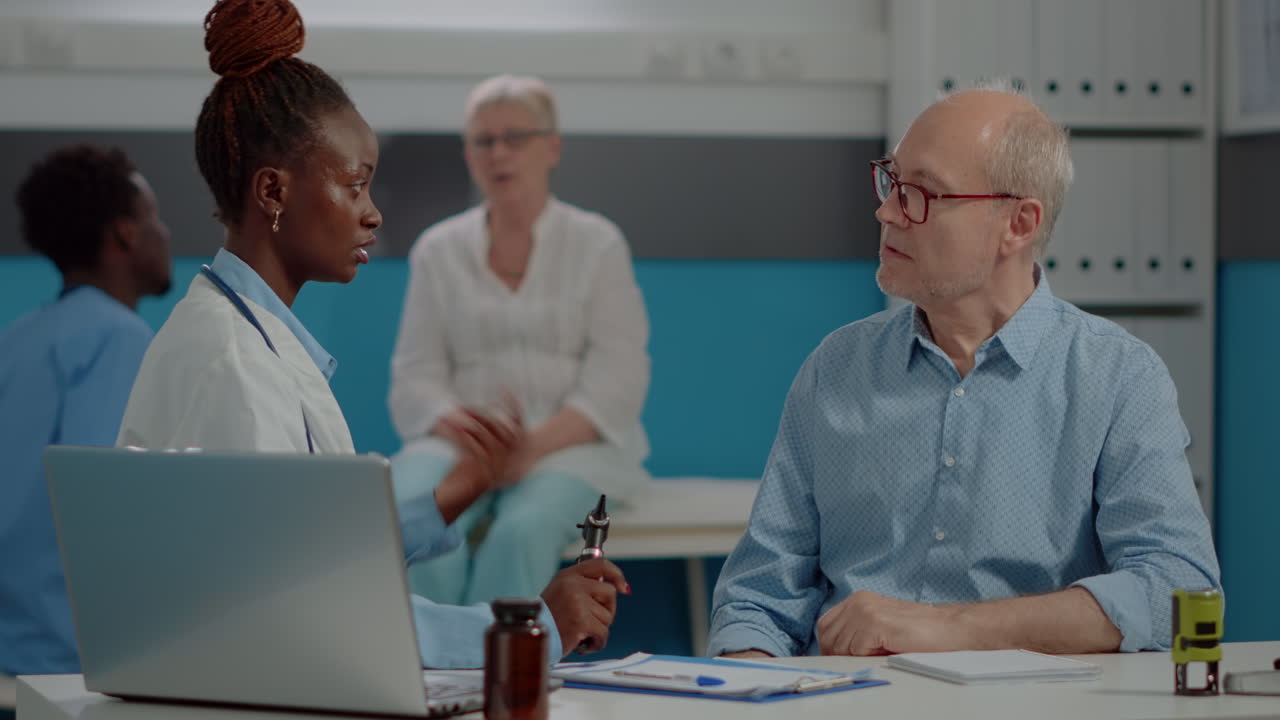 Medical consultation with doctor examining patient
