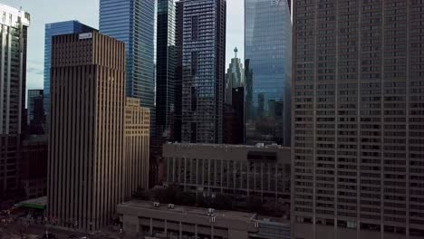 tall office buildings in the centre of a big city, wide drone reveal