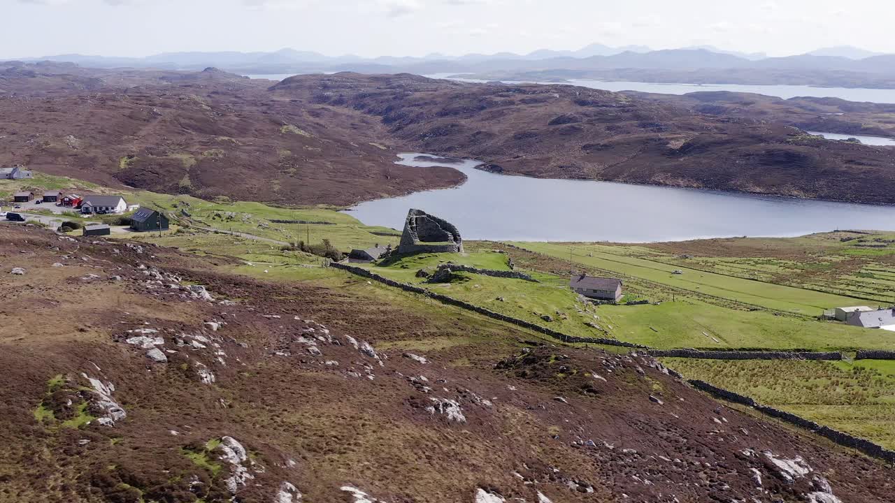 Drone shot circumnavigating the 'Dun Carloway Broch' on the west coast of the Isle of Lewis, part of the Outer Hebrides of Scotland