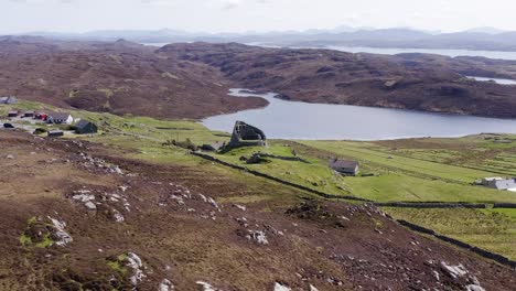 drone shot circumnavigating the 'dun carloway broch' on the west coast of the isle of lewis, part of the outer hebrides of scotland