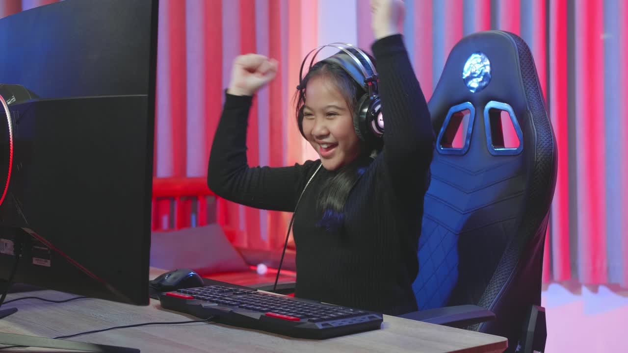 Excited Girl Celebrating a Victory in a Video Game