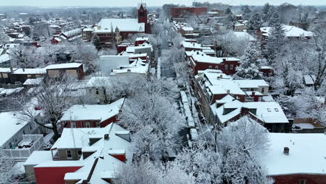 aerial reveal above street during winter snow