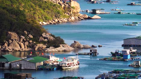 houseboat rafts with cages for fish farming in vinh hy bay, vietnam