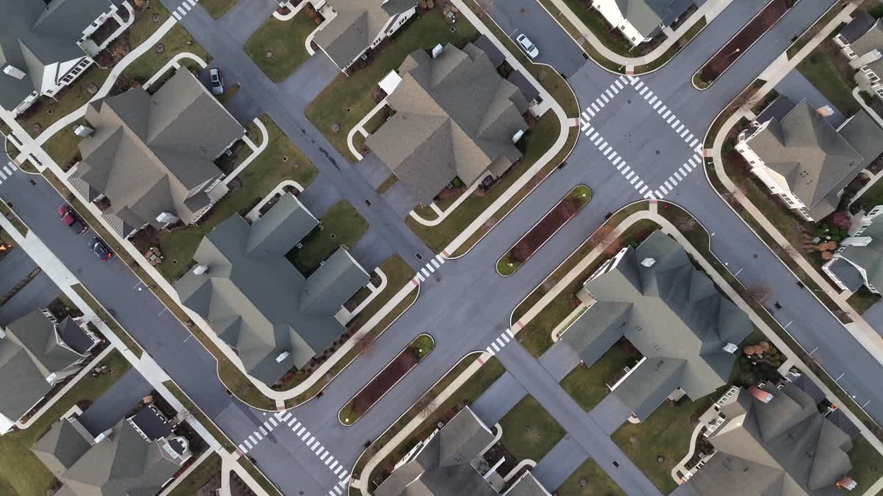 Affluent area with high-end villas in american luxury living community. Aerial top down flyover. New developed neighborhood in USA. Exclusive suburb estates.