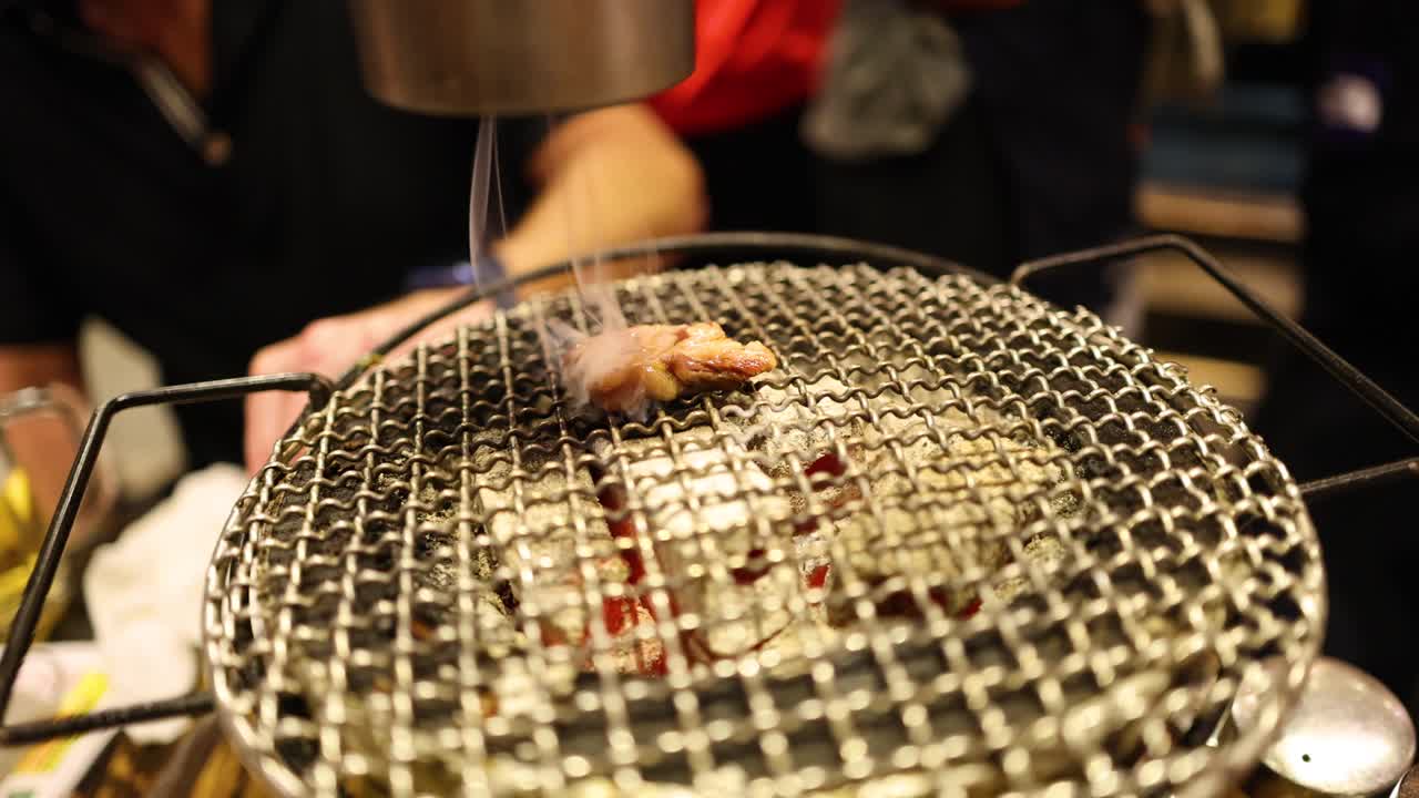 Showcasing a grill's smoke suction feature