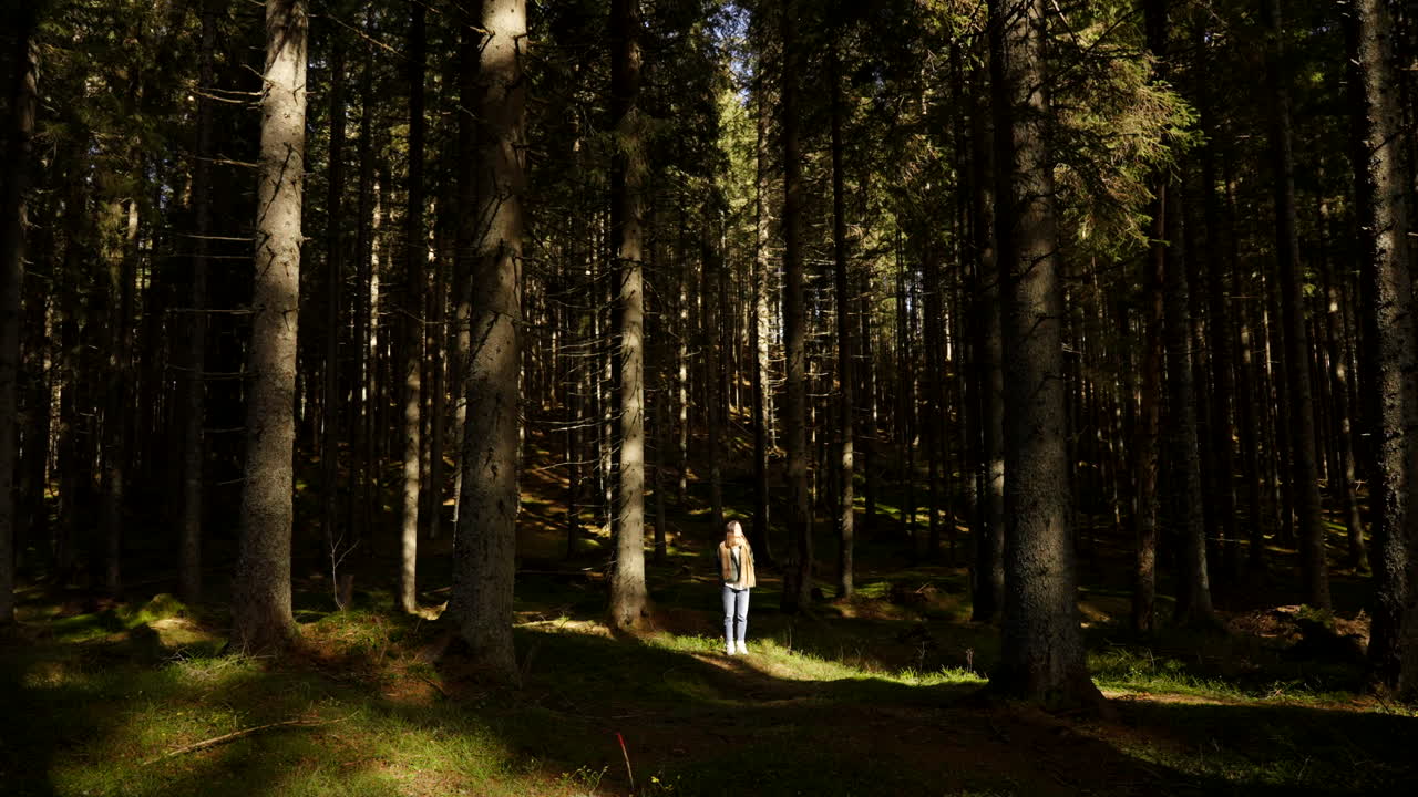 Woman in a pine forest