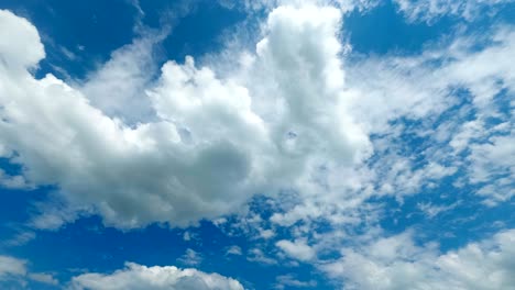 clouds are moving in the blue sky. time lapse