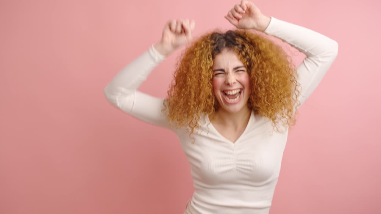 Joyful woman celebrating with energetic dance moves