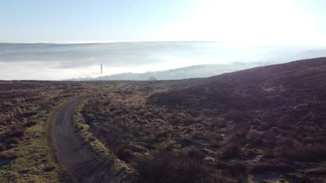 cloudy misty sunrise valley aerial moorland hiking hillside muddy path lancashire slow fly over meadow