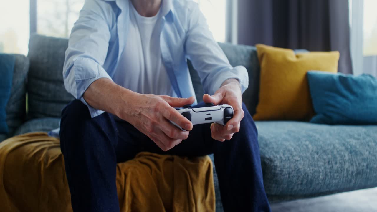 Man playing video games on couch