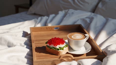 breakfast in bed with coffee and caviar sandwich